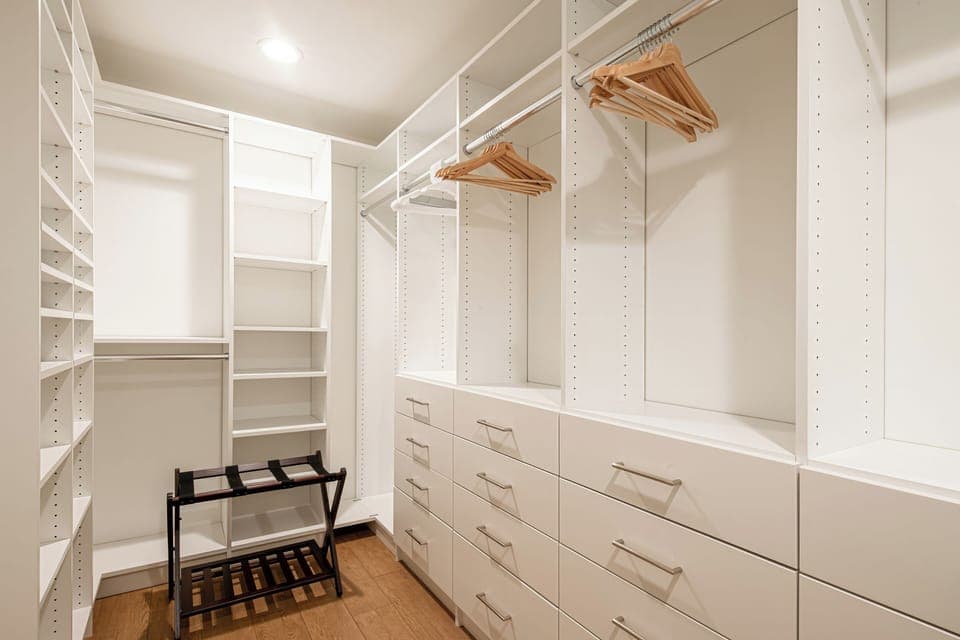 Walk-in closet in the primary bedroom.