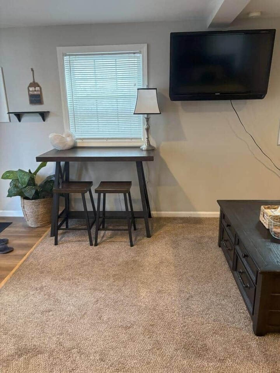 Catch up on emails or work during their stay, a dedicated workspace is available. The table provides plenty of room for your laptop and notes. It’s a quiet, practical spot to stay productive while away from home.