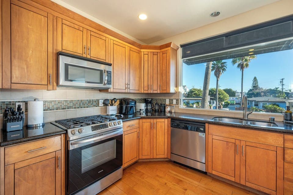 Full kitchen with bar seating, coffee maker, basic cooking essentials you need 