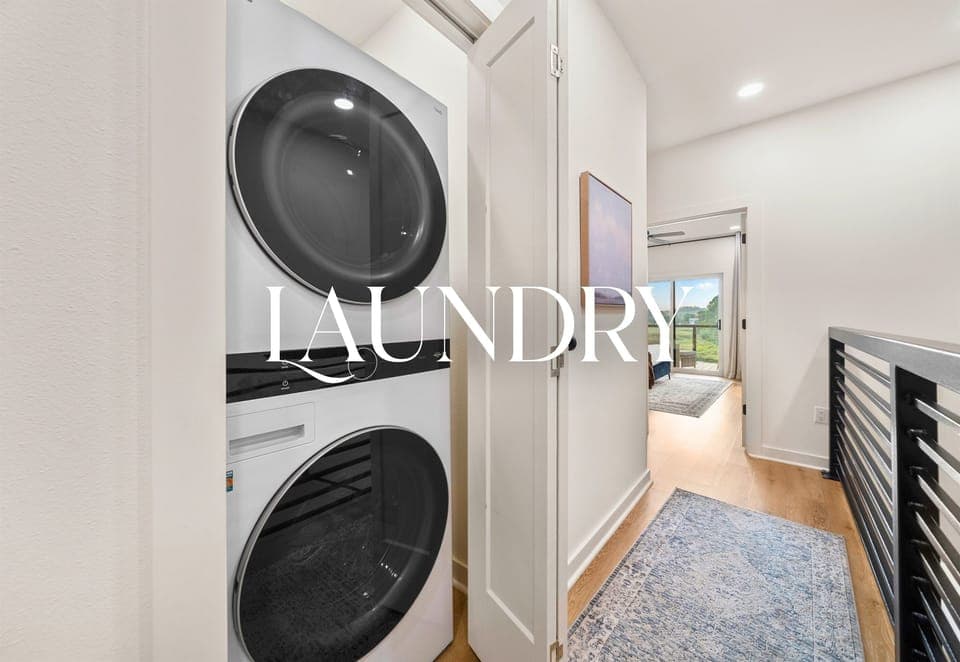 Laundry room with washer and dryer for guest convenience.