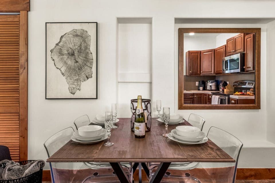 Secondary full sized kitchen on the terrace level with walkout to the lower terrace, a smart TV and dining table for 6