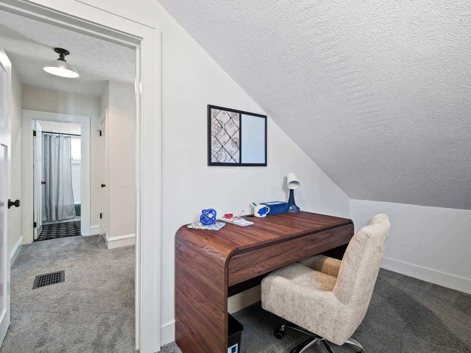 Simple hallway corner w/ a tidy desk—perfect for a quick workspace.