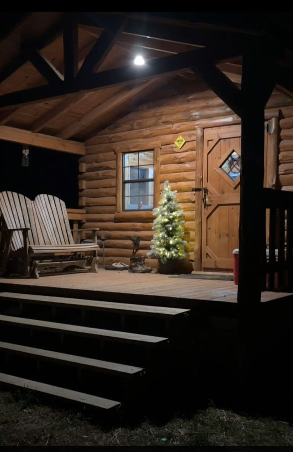 	“A welcoming porch dressed for the holidays at Haan Hollow.”