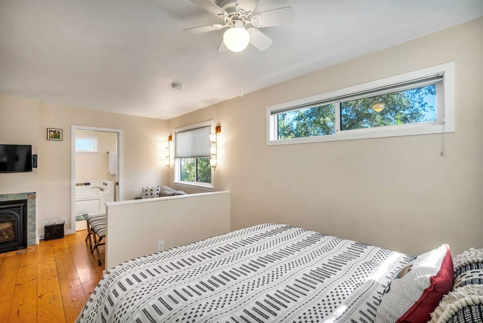 Wall separates bedroom; under-bed drawers provide plenty of storage.