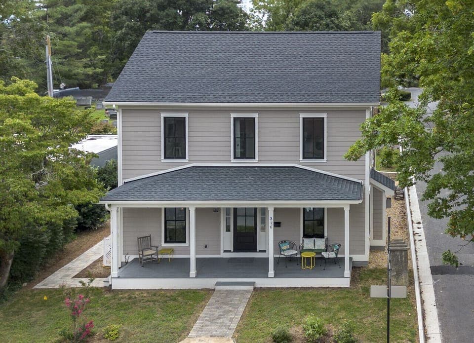 Exterior view of the home featuring a separate private entrance to the first-floor space