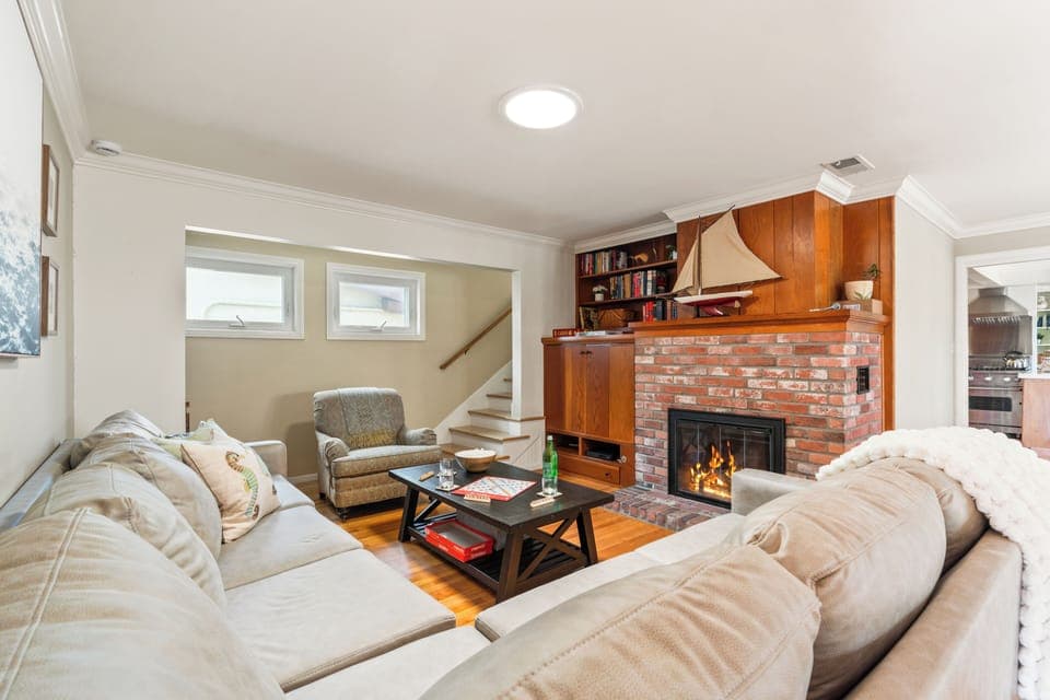 Cozy living room with fireplace and sectional seating.