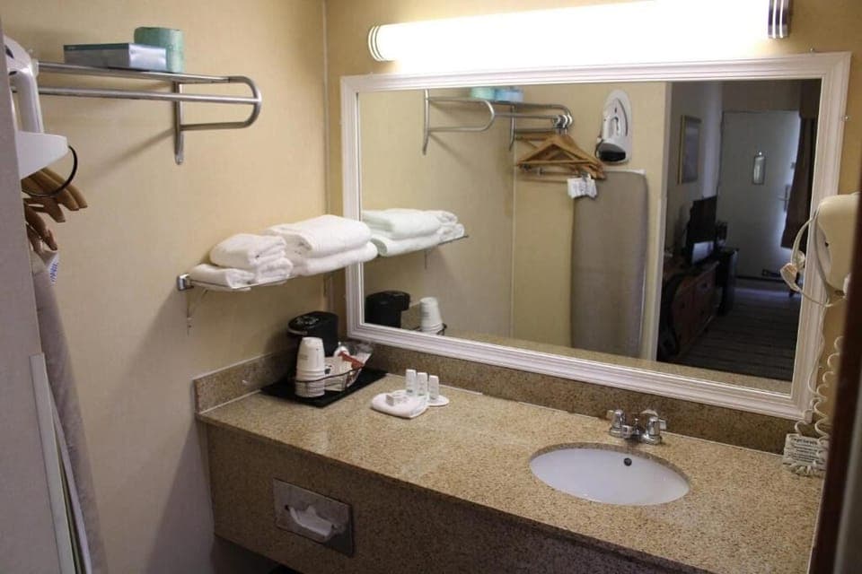 Refresh at a roomy vanity with bright mirror lighting.
