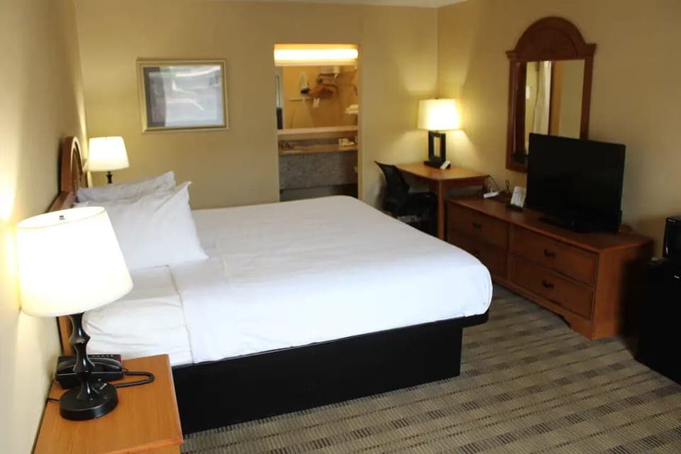Sink into crisp linens and relax with in-room TV.