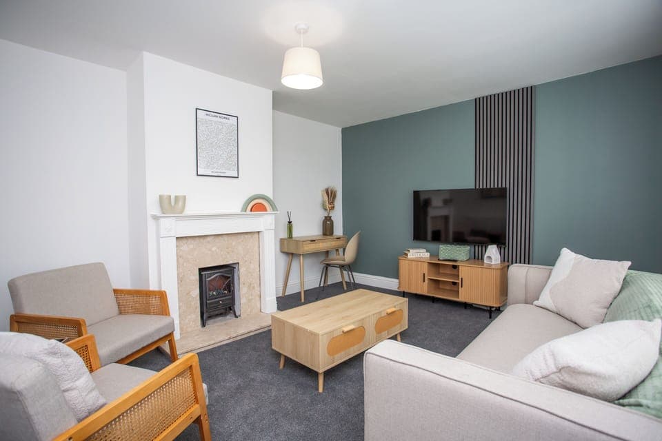 Modern living space with cozy seating and a calming atmosphere.