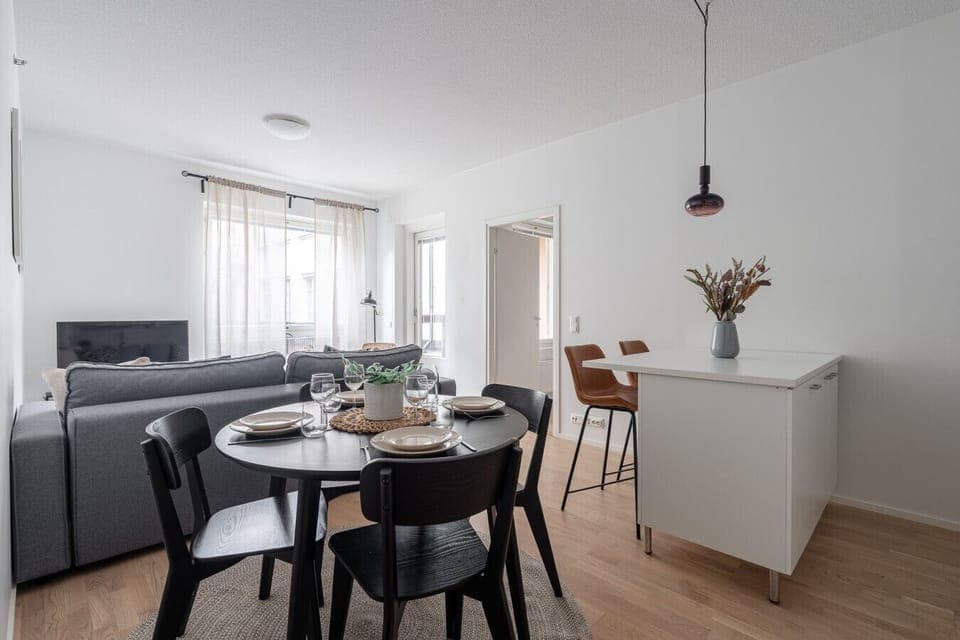 Enjoy meals at the dining table with plenty of natural light, conveniently located right next to the kitchen island.