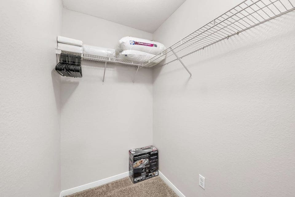 Spacious closet w/ shelving, perfect for longer stays.
