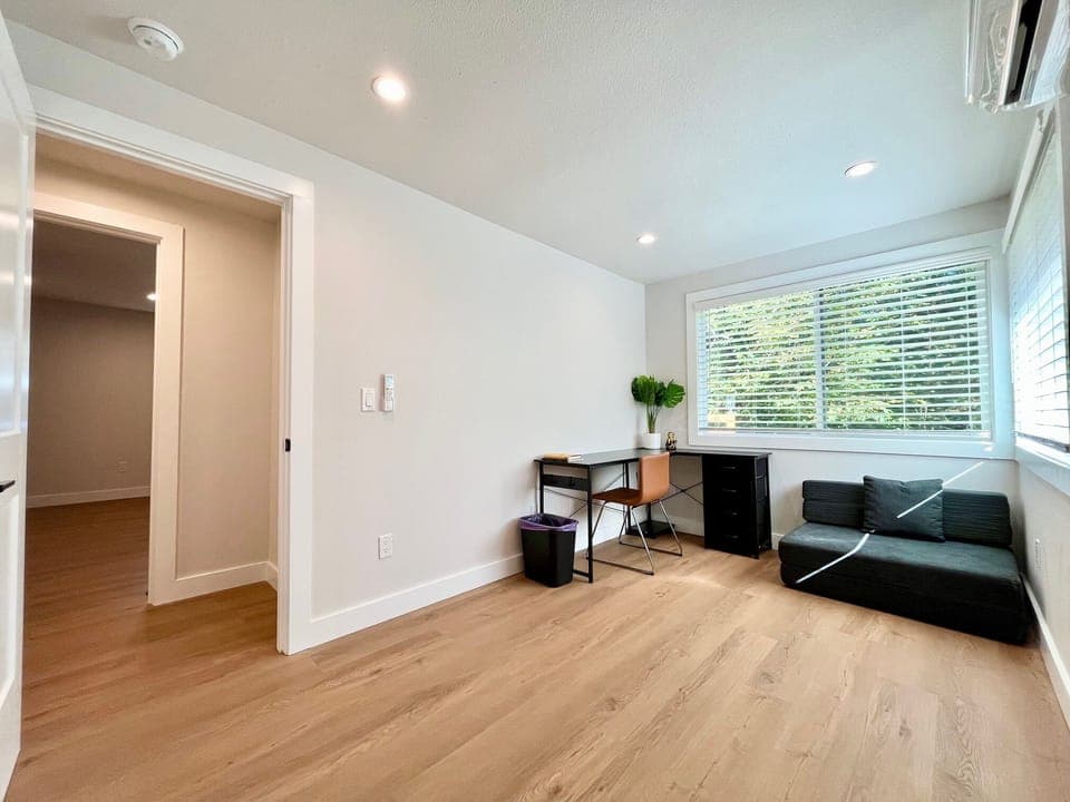 Another view of the office with big windows for natural light