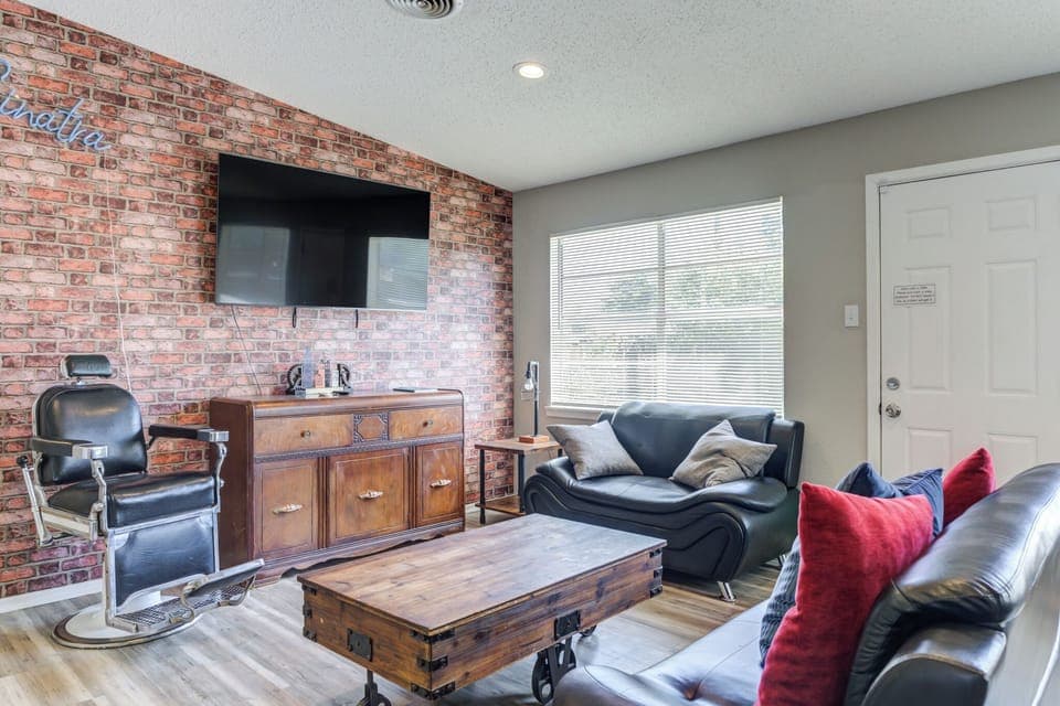 Relax in a sunny living room with sofa & TV 