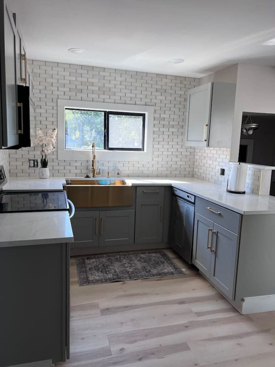 Kitchen with gold sink and dishwasher
