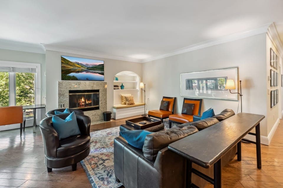 Living room with TV and fireplace