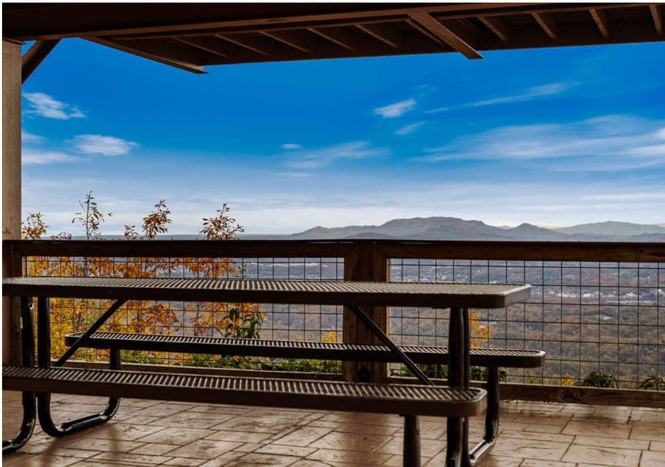 Outdoor picnic table with scenic mountain and valley views
