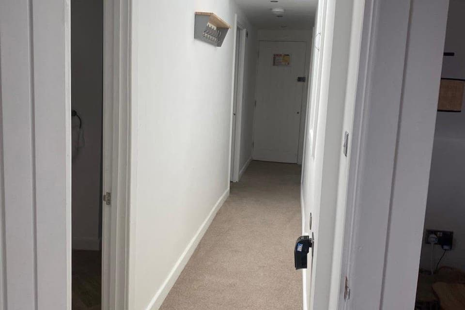 Bright central hallway connecting all rooms — a warm welcome as you step into your holiday home.