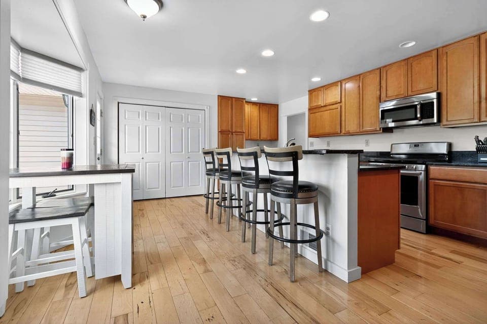 Large stocked kitchen with access to the back deck. 