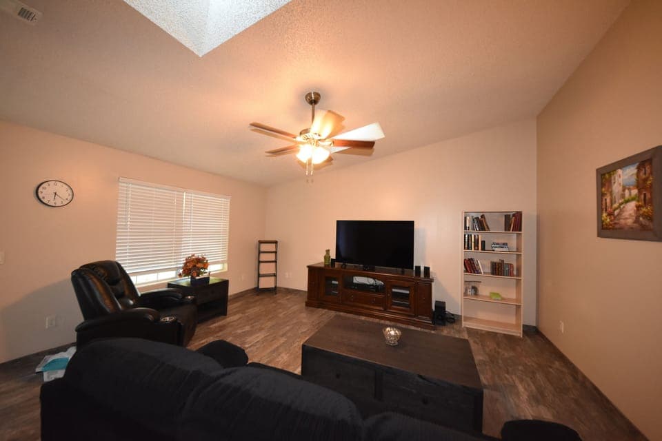 Spacious living room with 65" Roku TV