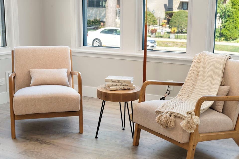 a chic arm chair and a sleek coffee table for relaxing with family or friends.