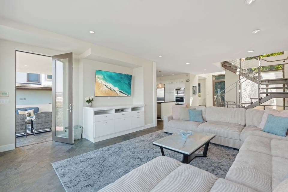 Main Floor Living Area Looking Out To View Patio.