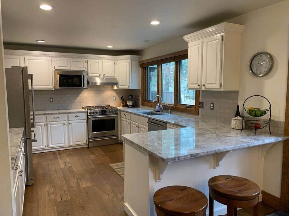 Updated kitchen with gas cooktop

Two swivel barstools for additional kitchen seating