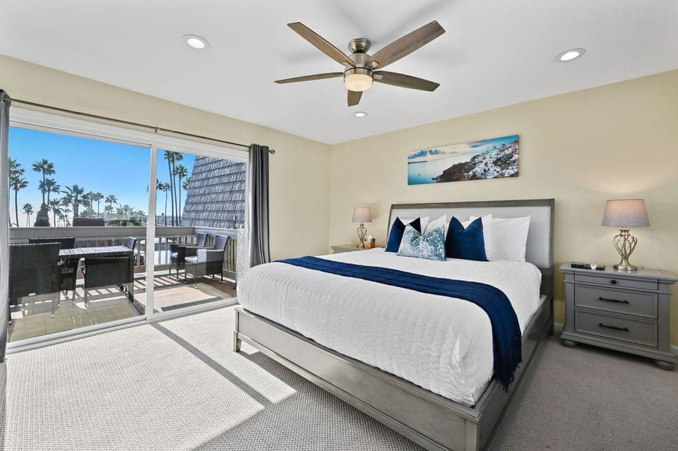 Upstairs primary bedroom features a king bed and beautiful ocean views