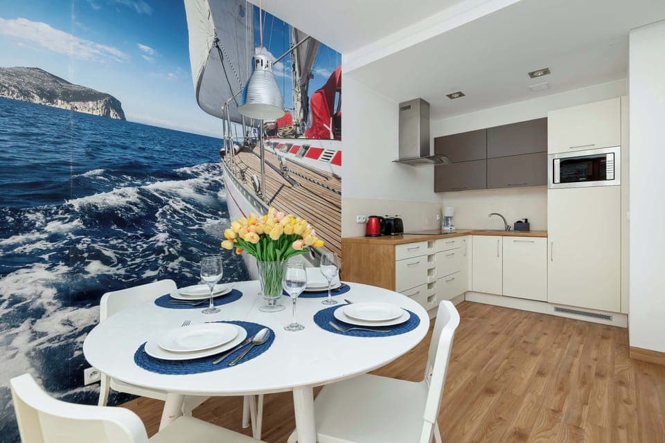 Large table with chairs for eating communal meals. 