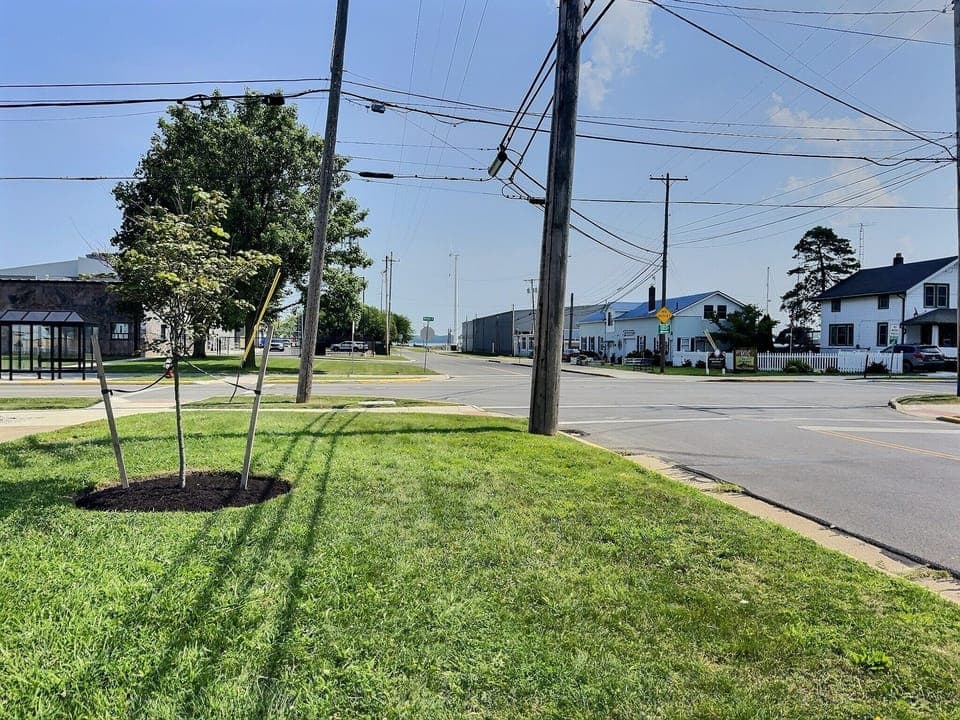 Front of the house  there is the water at the end of the street