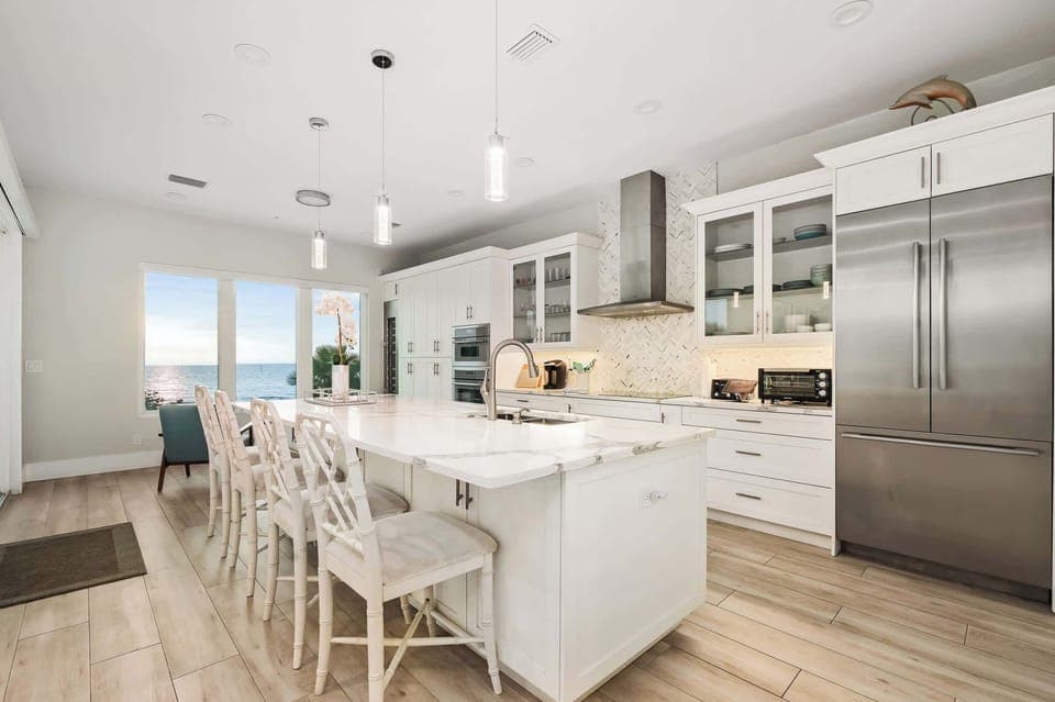 Start your mornings at the bright breakfast bar, where seating for four makes it the perfect place for casual meals, coffee, or evening wine with friends.