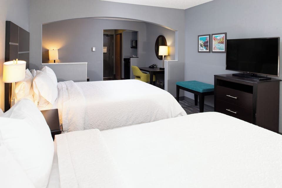 Sink into crisp white bedding for a deeply restful night.
