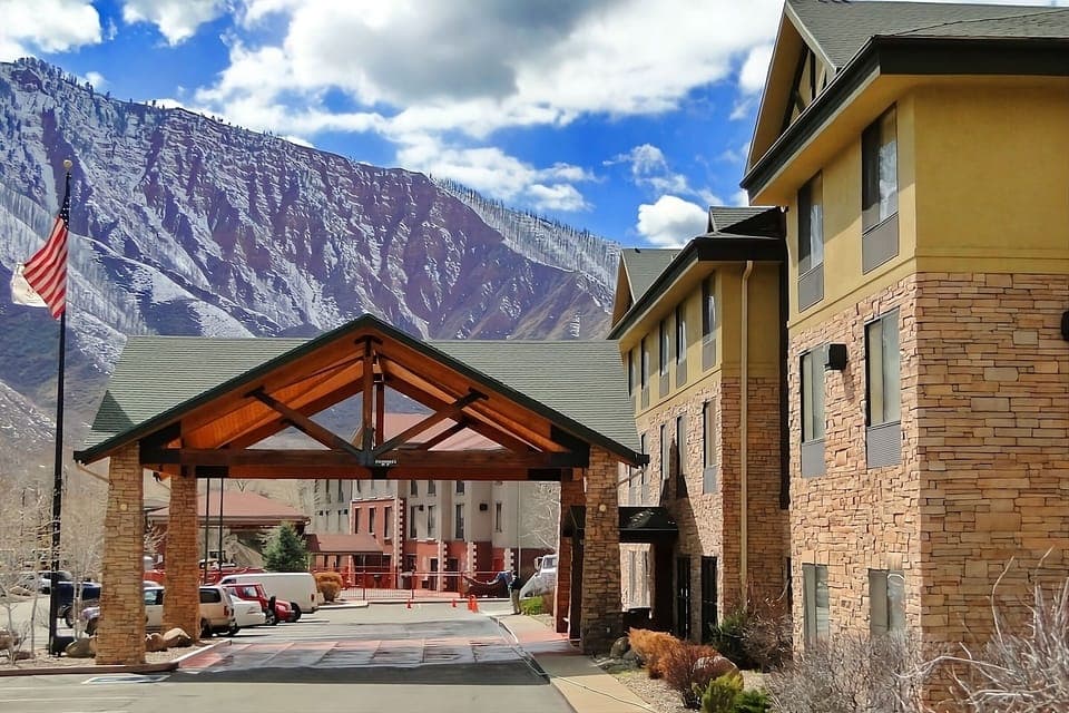 Pull up under the covered entry with mountain views.