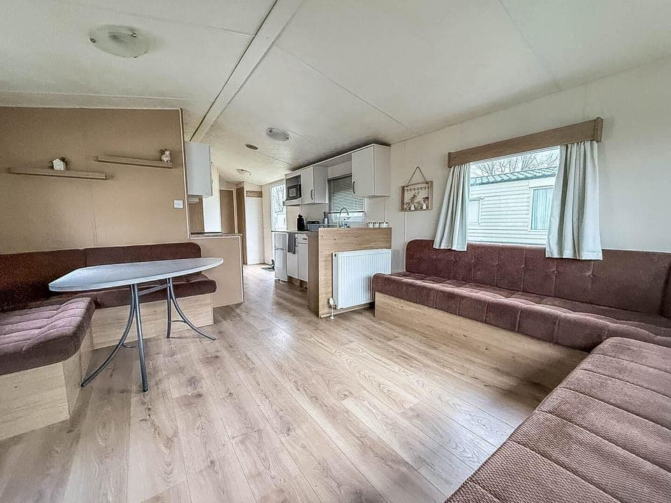 Spacious living and dining area with cozy seating and natural light