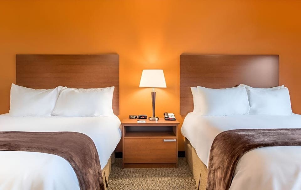 Sink into crisp linens and share the nightstand glow.