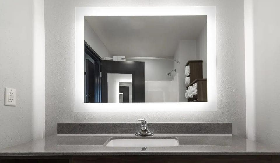Get ready easily with the large lit mirror and counter space.
