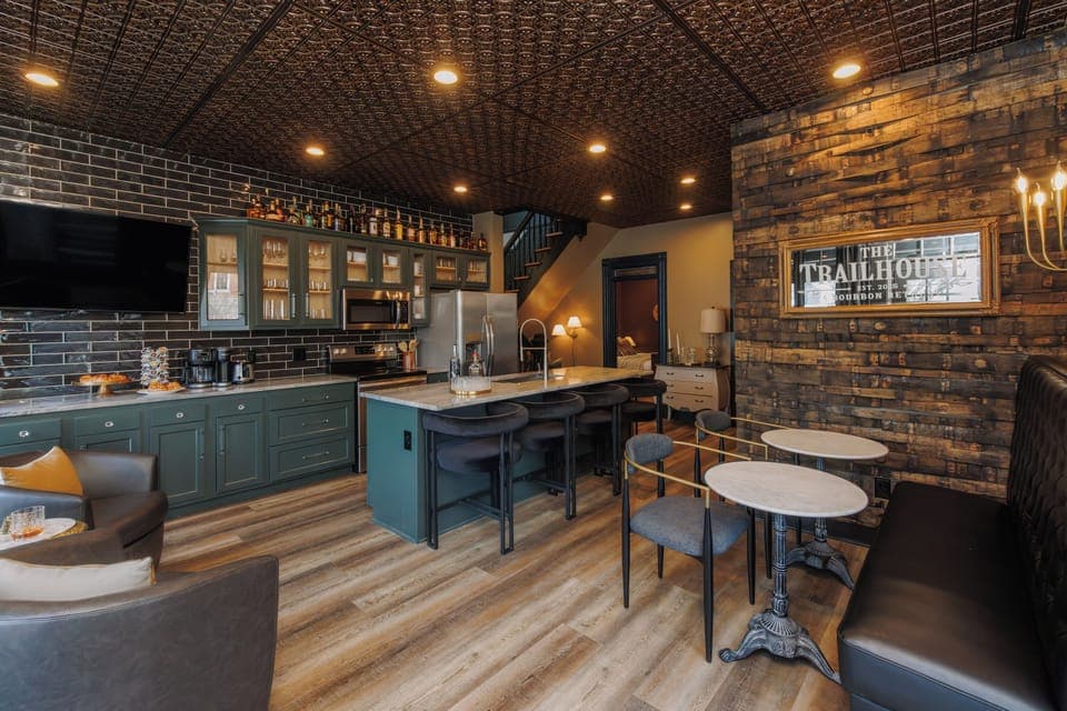 Relax in the stylish lounge area featuring stone walls and cool decor.