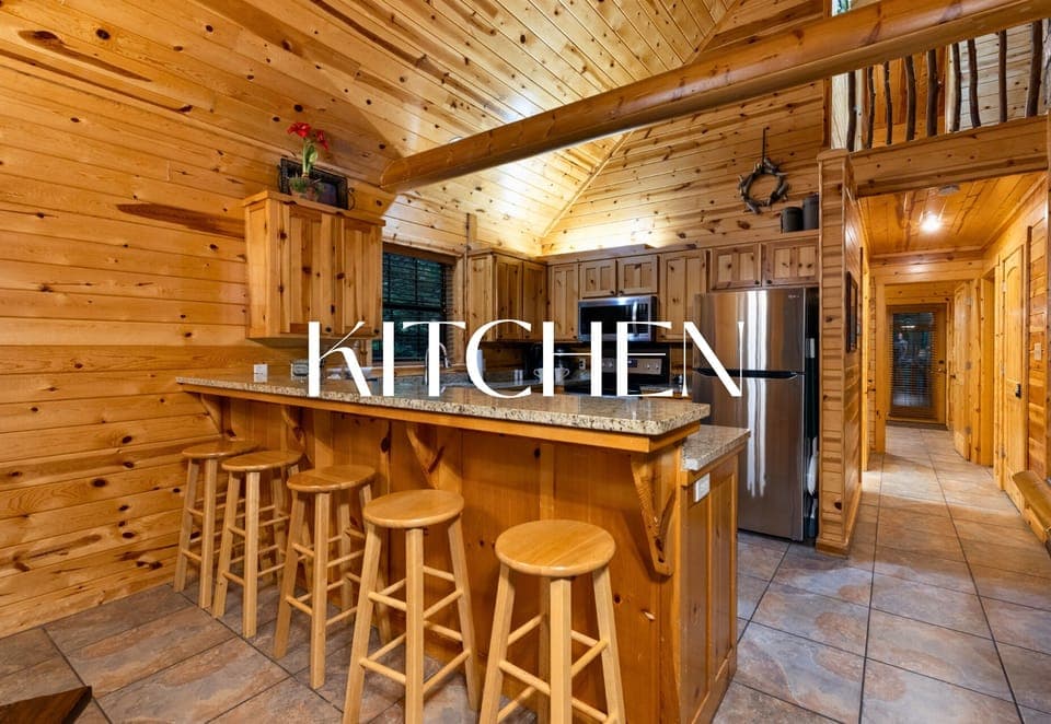 Rustic cabin kitchen with bar seating for group meals.