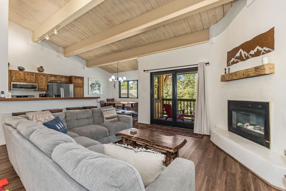 Stretch out on the large couch, warm up by the fire & step onto the balcony