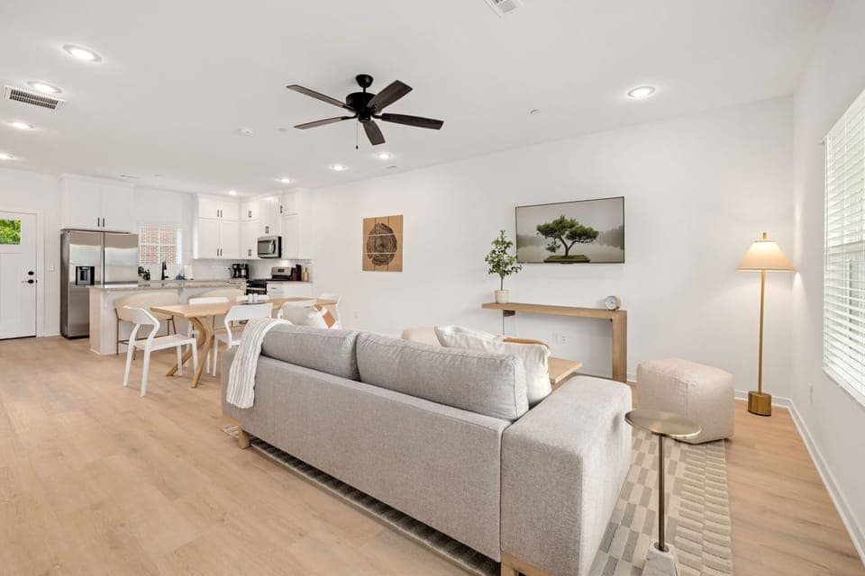 The living room features a large Smart TV with all your favorite streaming channels, along with plush seating. 