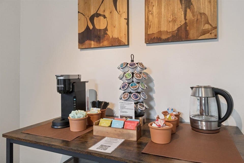 Morning moments at Varsity Alfresco—our industrial-chic nook features a high-top table, bike-pedal stools, and a stocked coffee station. Comfort and connection near Notre Dame.