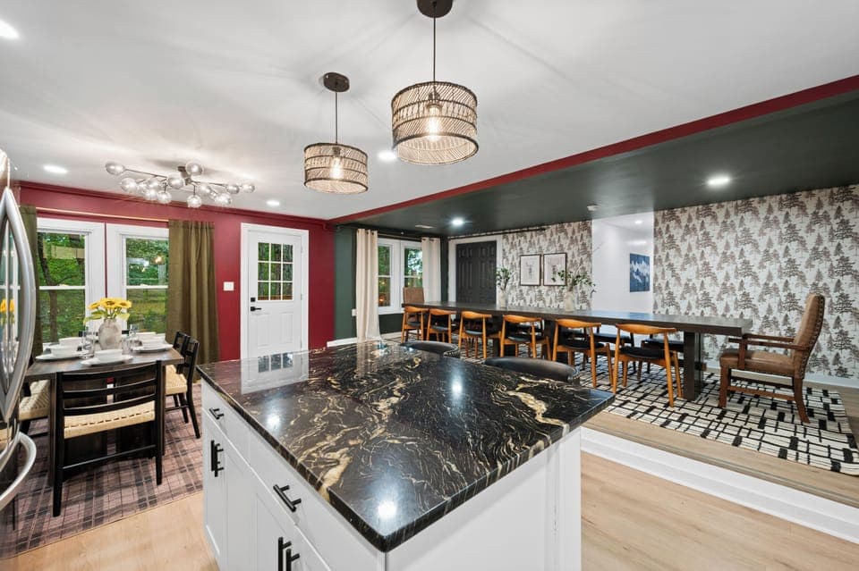 Our fully stocked kitchen, complete with modern lighting, offers the perfect space for creating culinary delights.