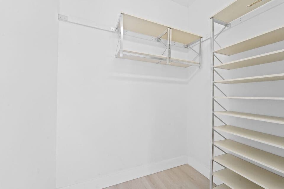 Spacious Walk In Wardrobe with Organized Storage for All Your Belongings