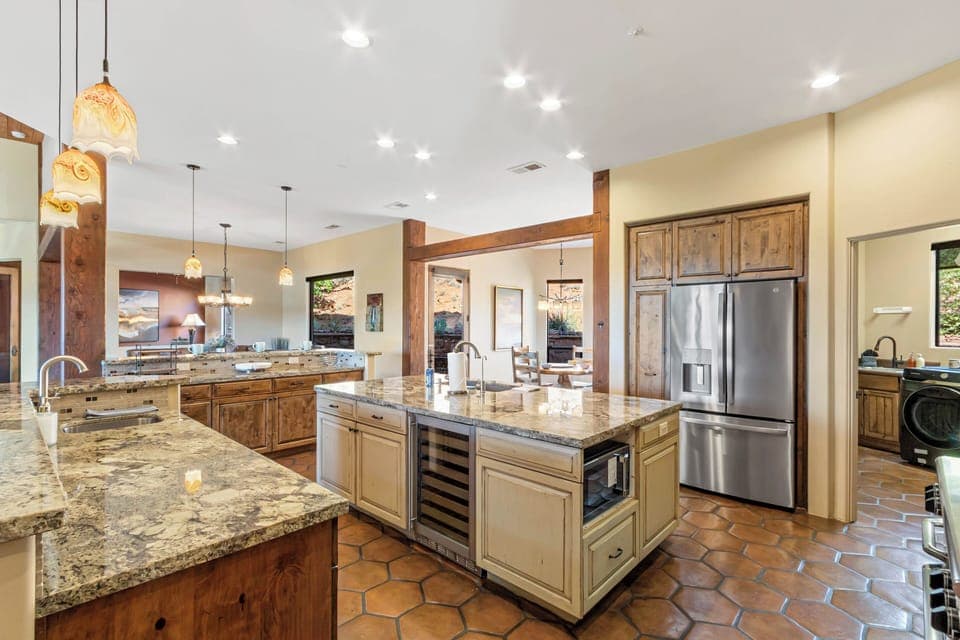 Chef's kitchen with a wine fridge and water/ice on the refrigerator door