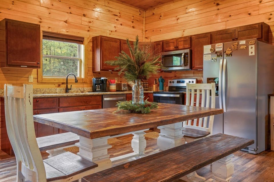 Enjoy meals together in the open dining and kitchen area, designed for both comfort and convenience.