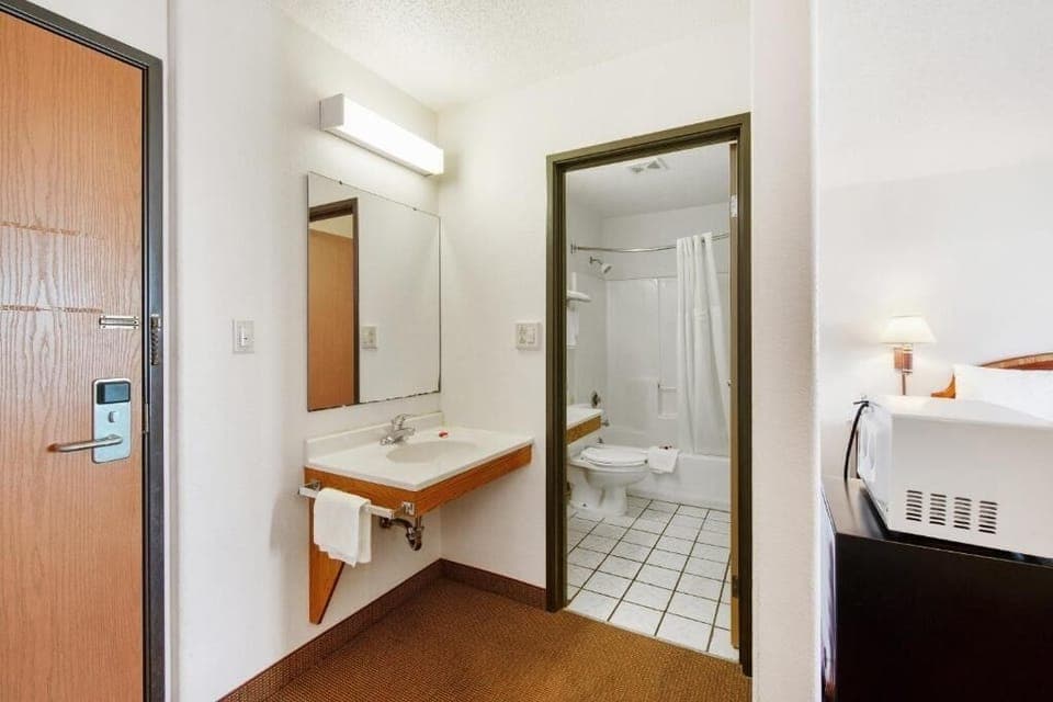 Freshen up easily with a wide vanity and bright mirror.