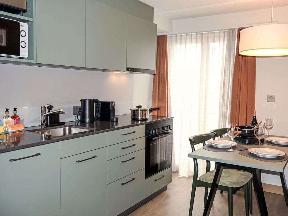 Furniture, Kitchen, Countertop, Cabinetry, Interior Design, Major Appliance, Flooring, Kitchen Appliance, Drawer, Kitchen Stove