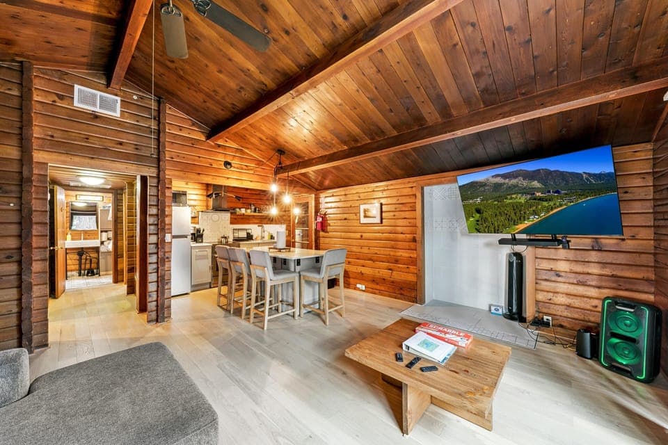 Cozy living room with vaulted ceilings and rustic charm