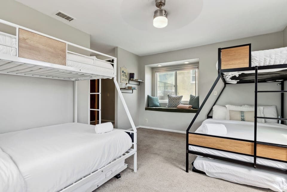 Bunk room with clean design and natural light. 