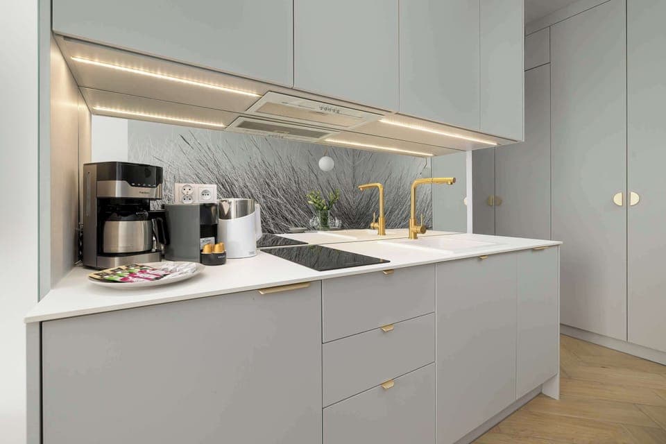 Cook and dine in style with the modern kitchenette and dining area.