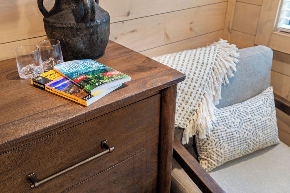 Cozy reading nook with soft pillows, warm textures
